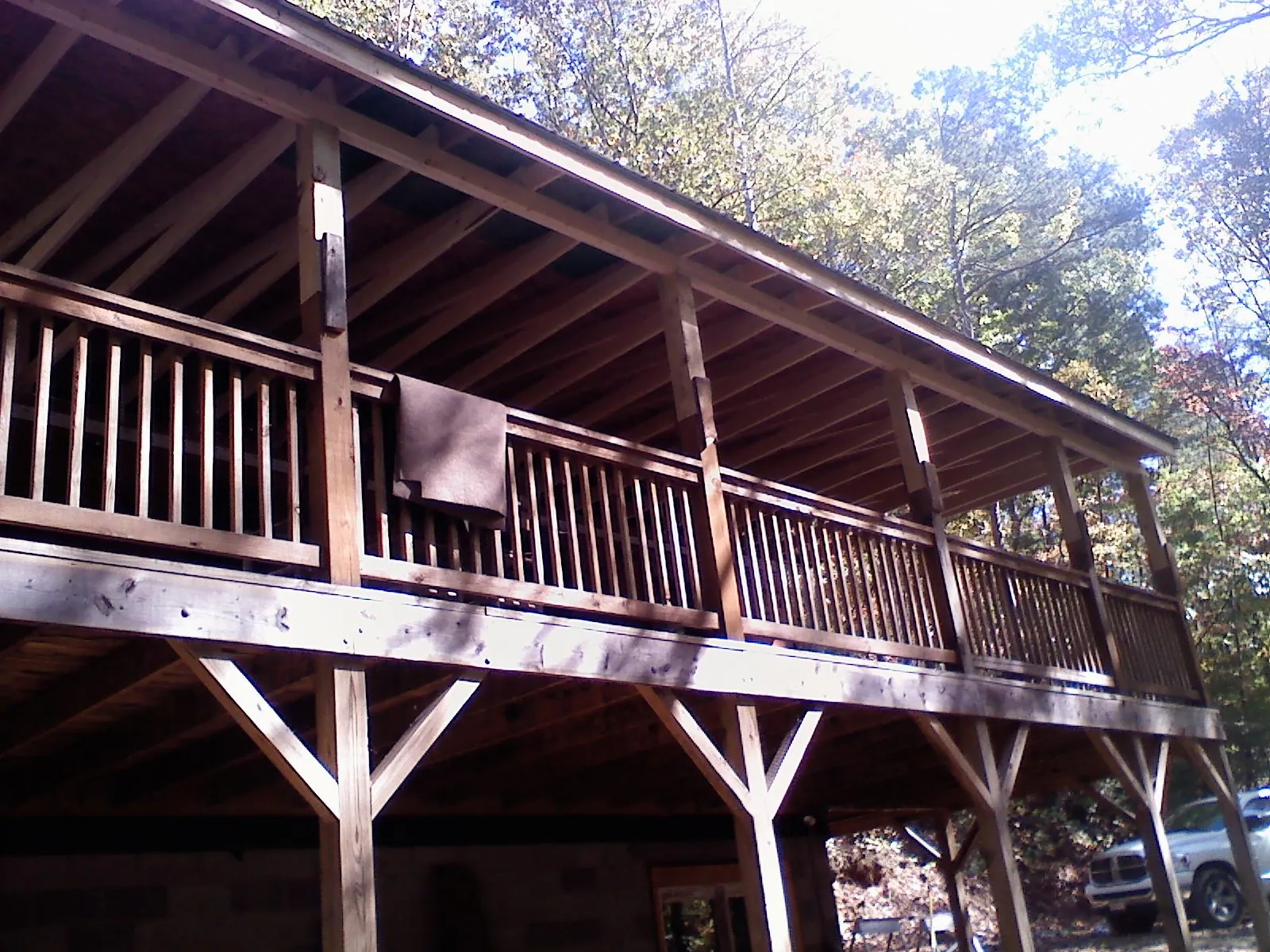 Timber framing under a new elevated porch and deck — Roof Leak Repair in Candia by Roofing Brothers